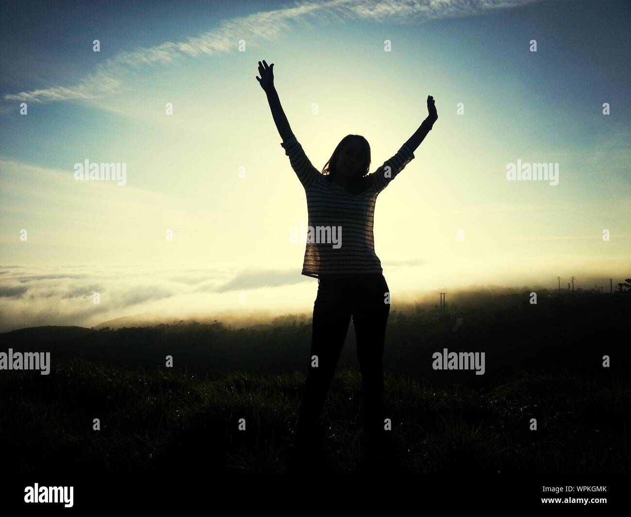 Woman arms raised dramatic hi-res stock photography and images - Alamy