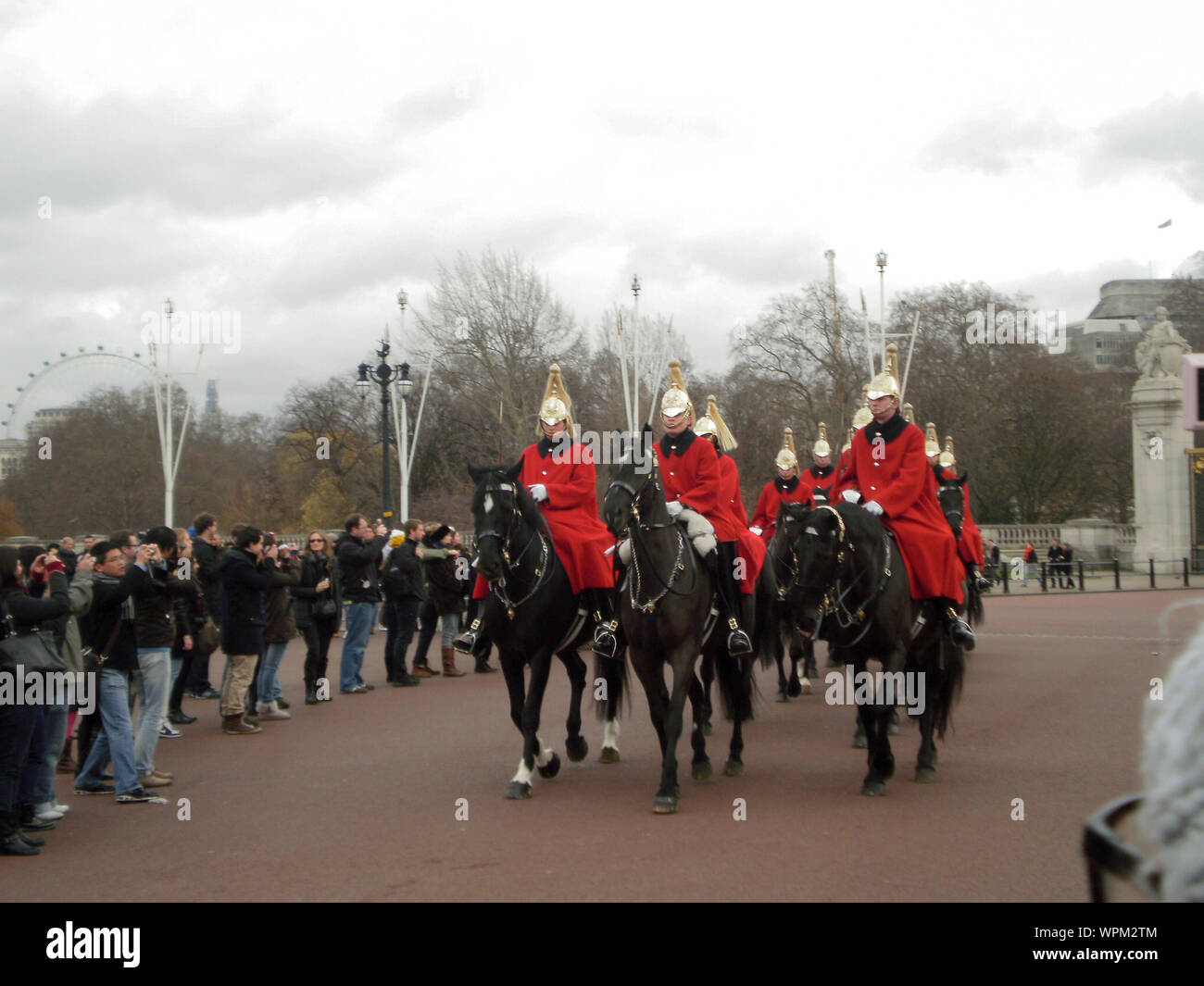 Royal Guard of Her Majesty Queen on horseback passing through the