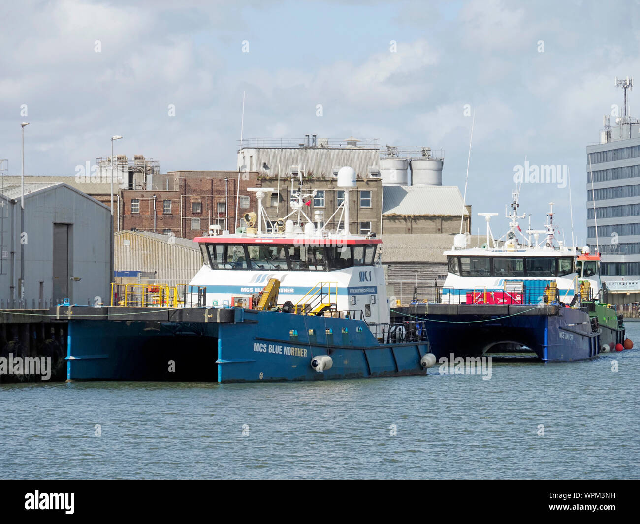 Marine Craft Services (MCS) crew transfer vessels moored on the Gorleston side of the port of Great Yarmouth. Stock Photo