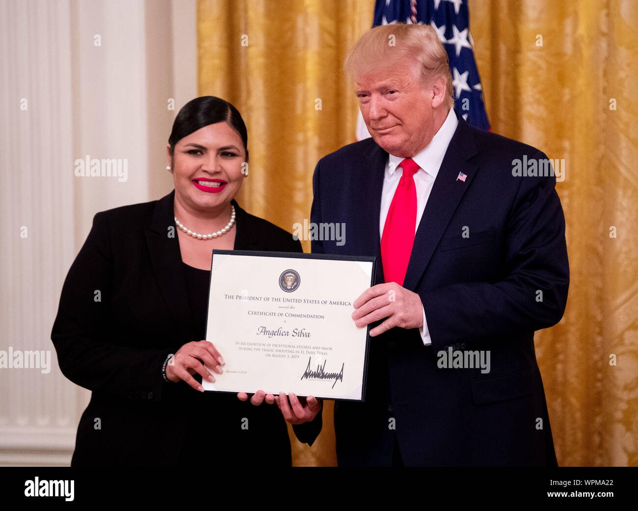 Washington, United States. 09th Sep, 2019. President Donald Trump awards a Heroic Commendations to Angelica Silva for her heroic actions during a mass shooting, during a ceremony in the East Room at the White House in Washington, DC on Monday, September 9, 2019. Trump recognized the six Dayton officers who stoped a mass shooting on August 4th and honored 5 civilians who helped during a mass shooting at a Walmart in El Paso a day before. Photo by Kevin Dietsch/UPI Credit: UPI/Alamy Live News Stock Photo