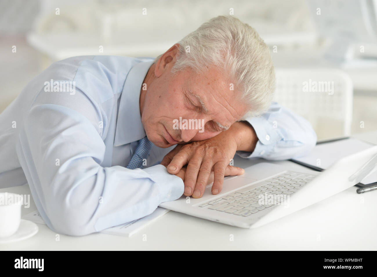 Mature adult man sleeping laptop hi-res stock photography and images ...