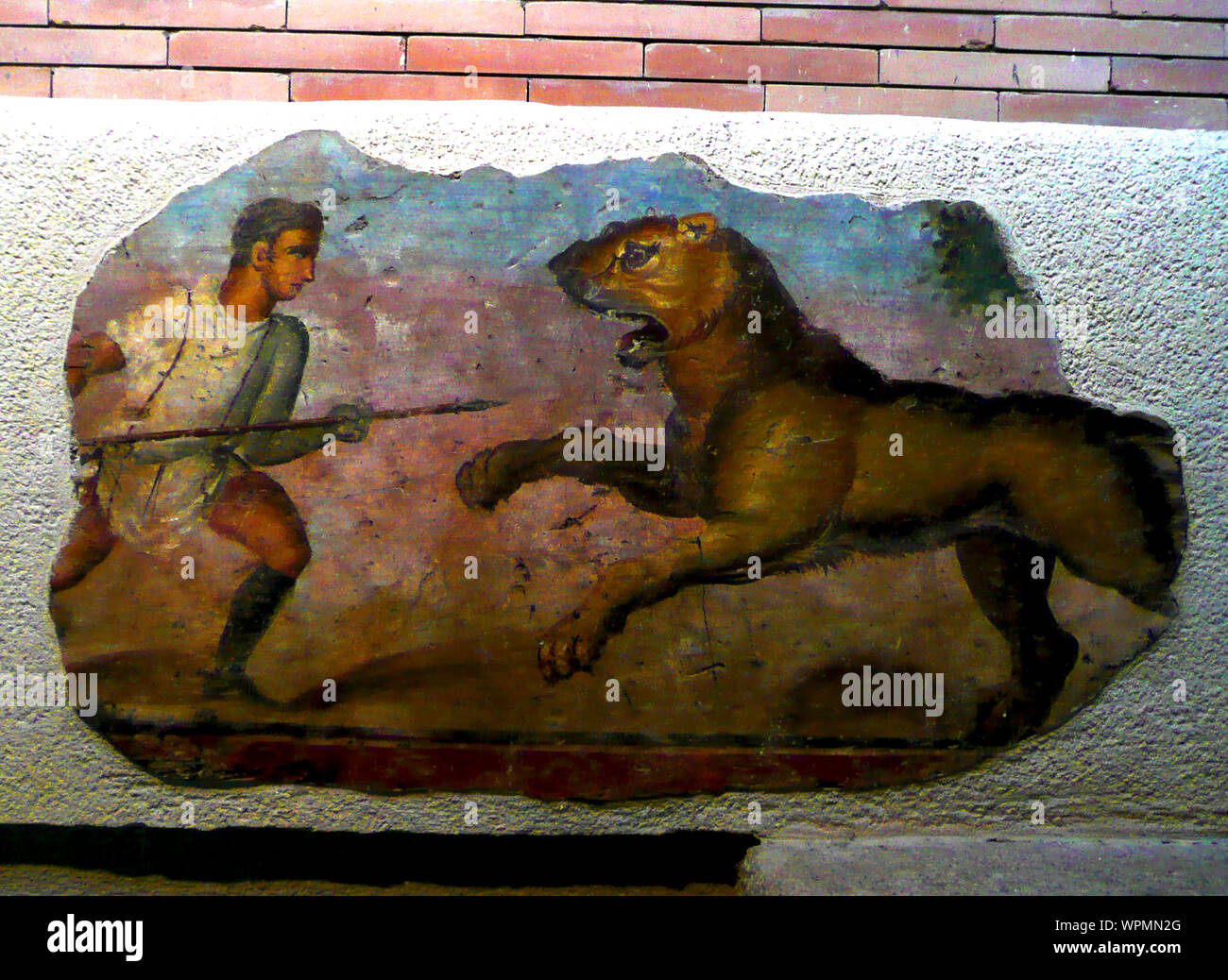 National Museum of Roman Art, Merida, Spain (2009 photograph) a slave (or gladiator) fighting a lion. Stock Photo