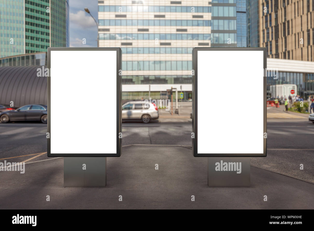 Two blank street billboard poster stands mock up on city business ...