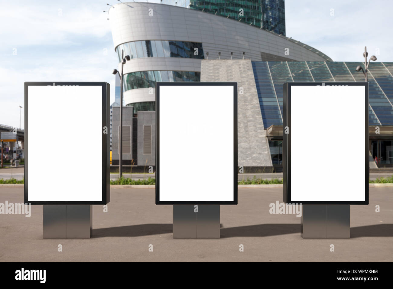 Three blank street billboard poster stands mock up on city business ...