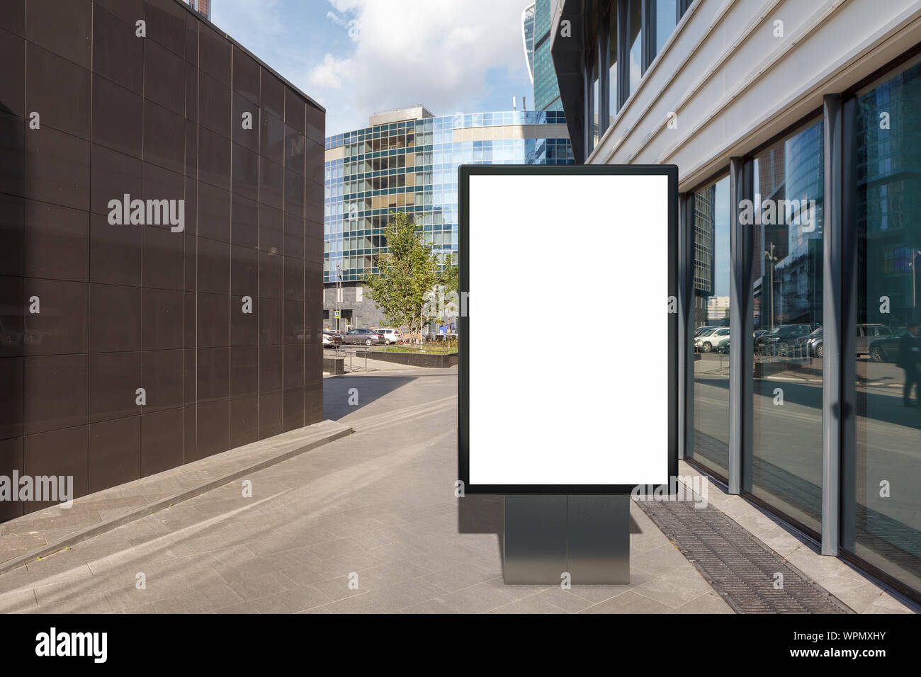 Blank street billboard poster stand mock up on city business district ...
