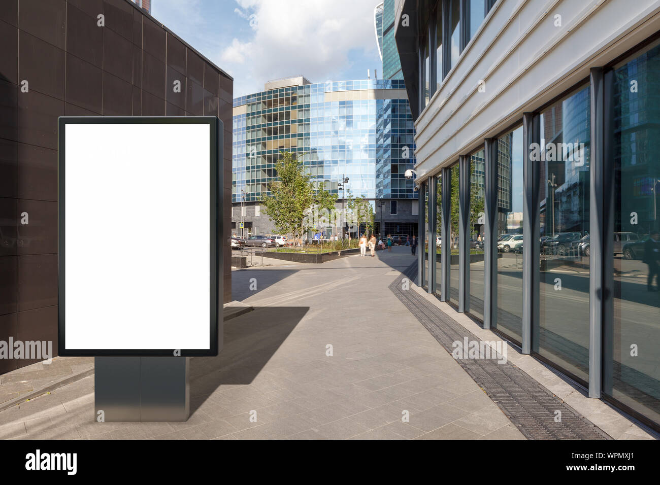 Blank street billboard poster stand mock up on city business district ...