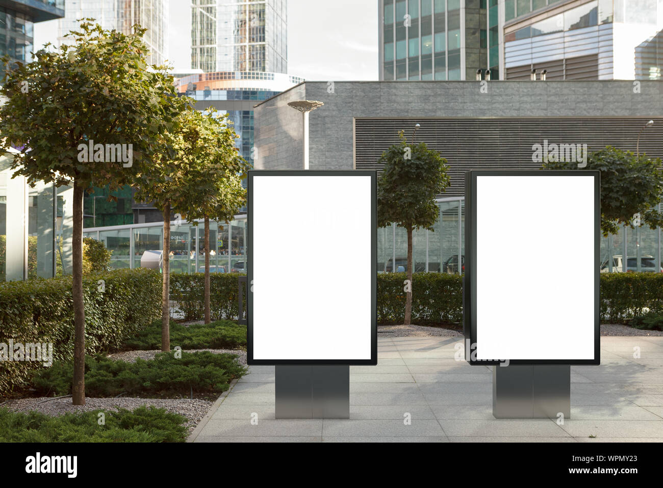 Two blank street billboard poster stands mock up on city business ...