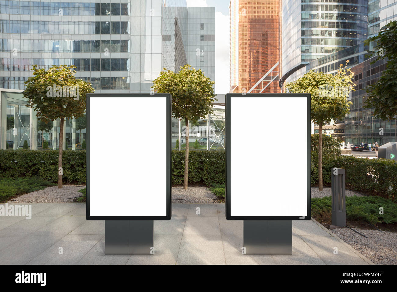 Two blank street billboard poster stands mock up on city business ...