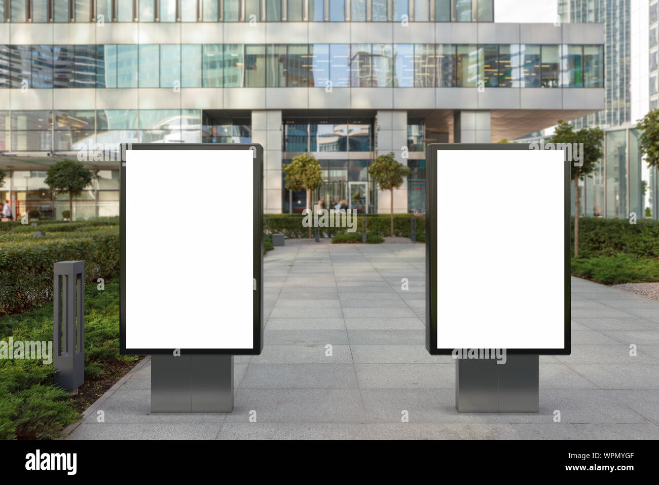 Two blank street billboard poster stands mock up on city business ...