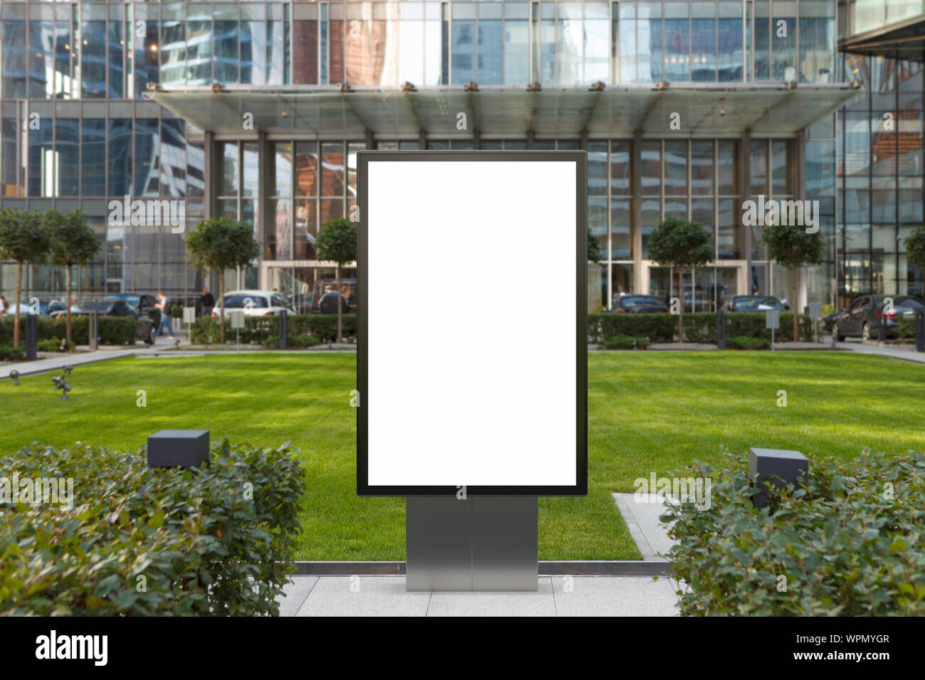 Blank street billboard poster stand mock up on the lawn in city ...