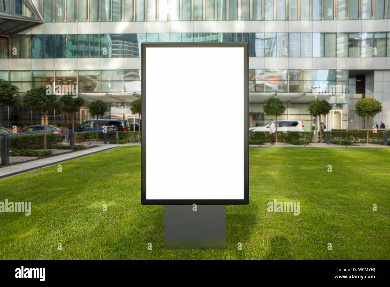 Blank street billboard poster stand mock up on the lawn in city ...
