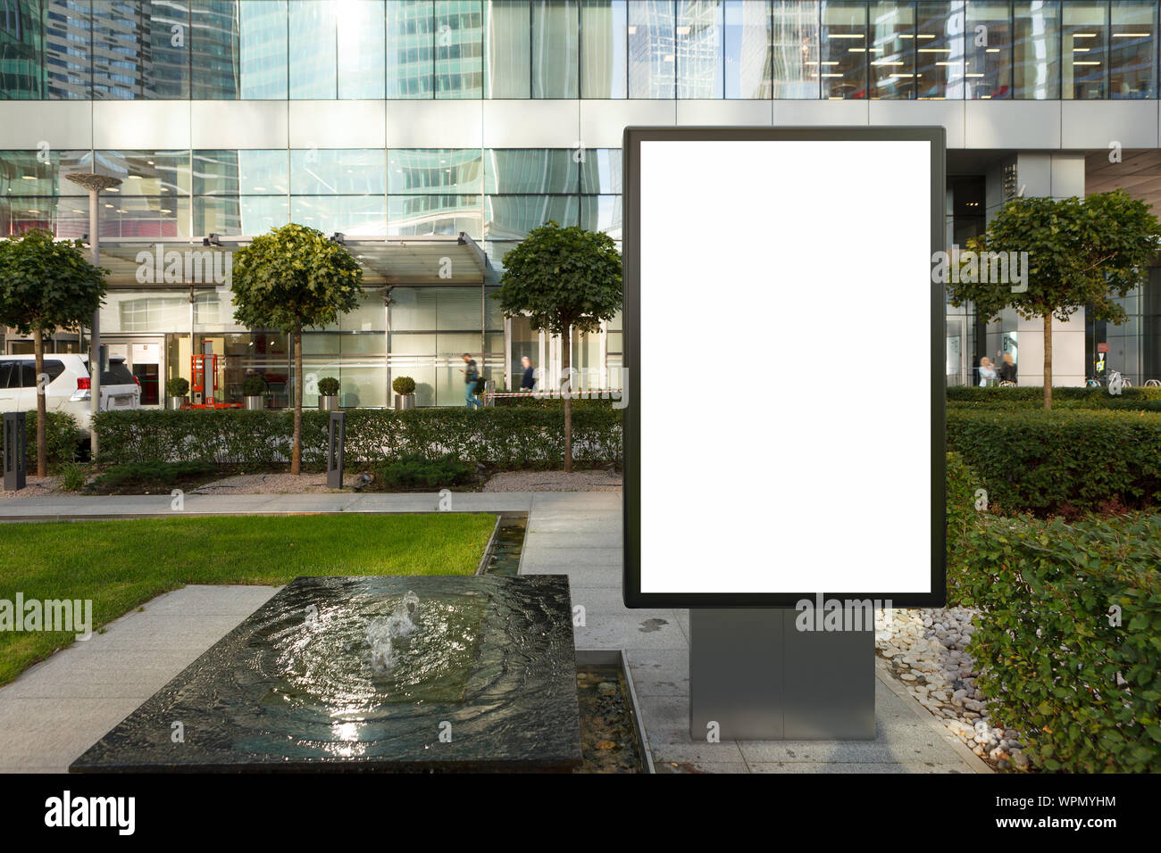 Blank street billboard poster stand mock up on the lawn in city ...