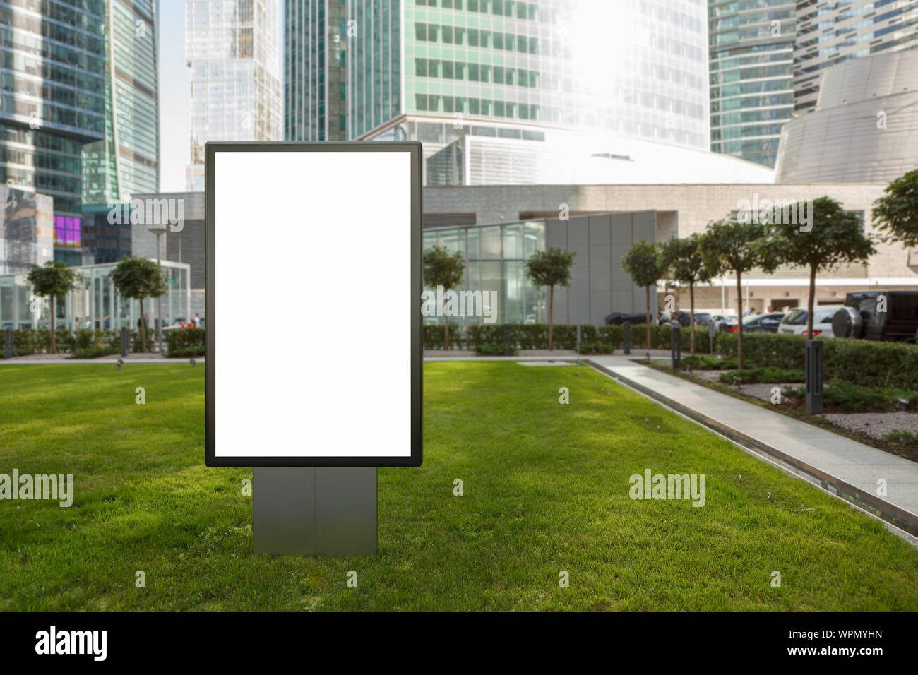 Blank street billboard poster stand mock up on the lawn in city ...
