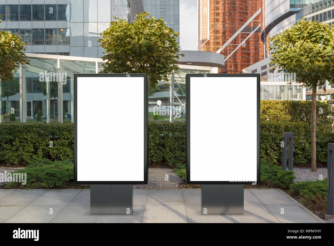 Two blank street billboard poster stands mock up on city business ...