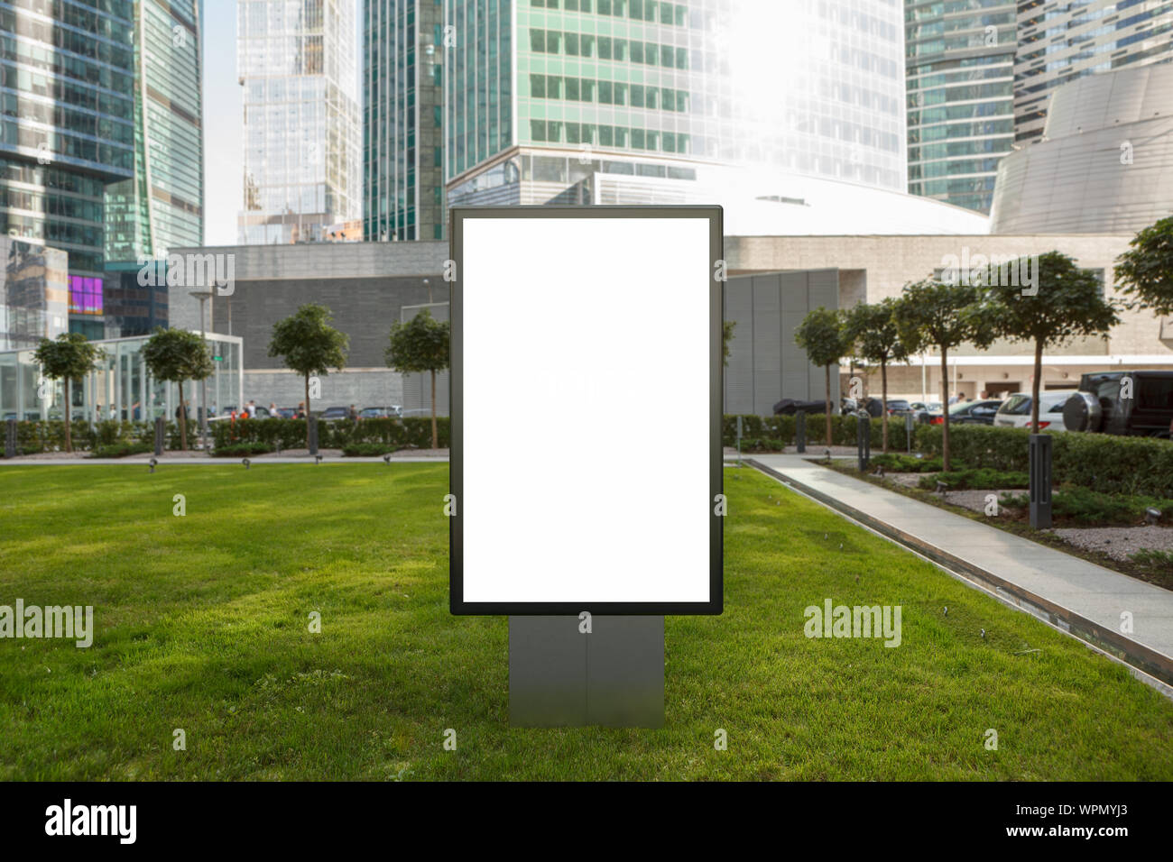 Blank street billboard poster stand mock up on the lawn in city ...