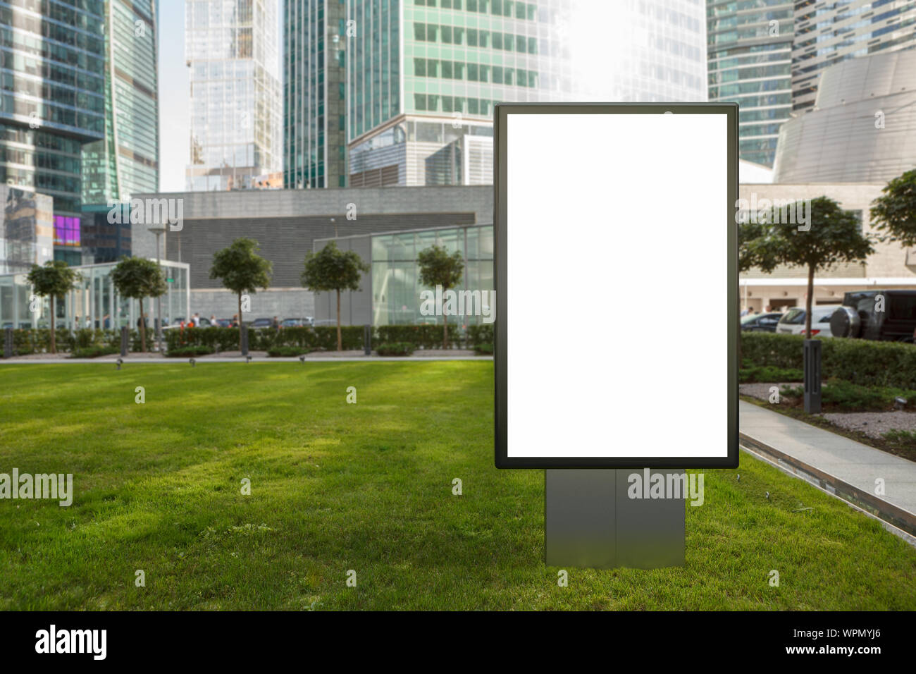 Blank street billboard poster stand mock up on the lawn in city ...