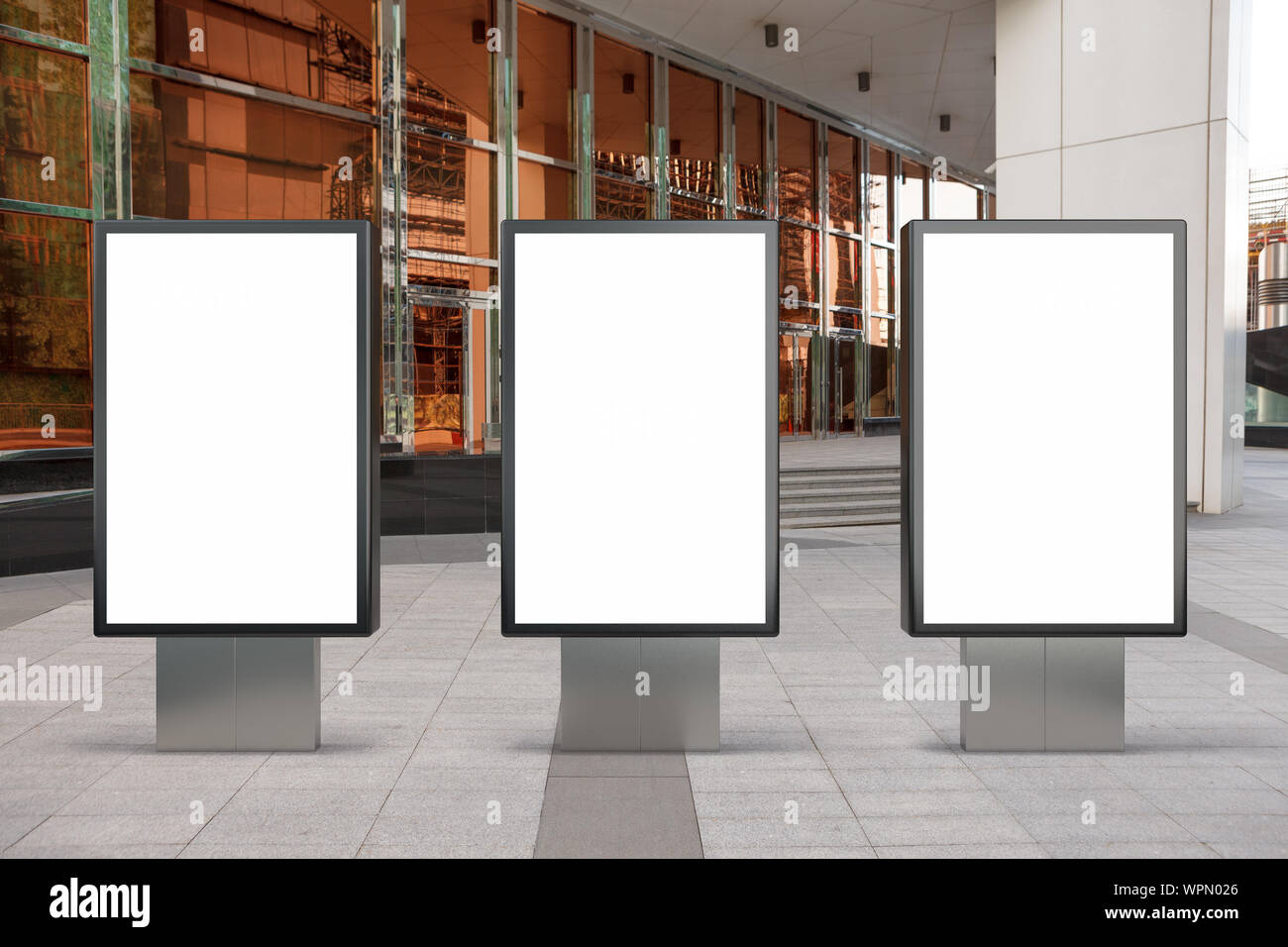 Three blank street billboard poster stands mock up in city downtown ...