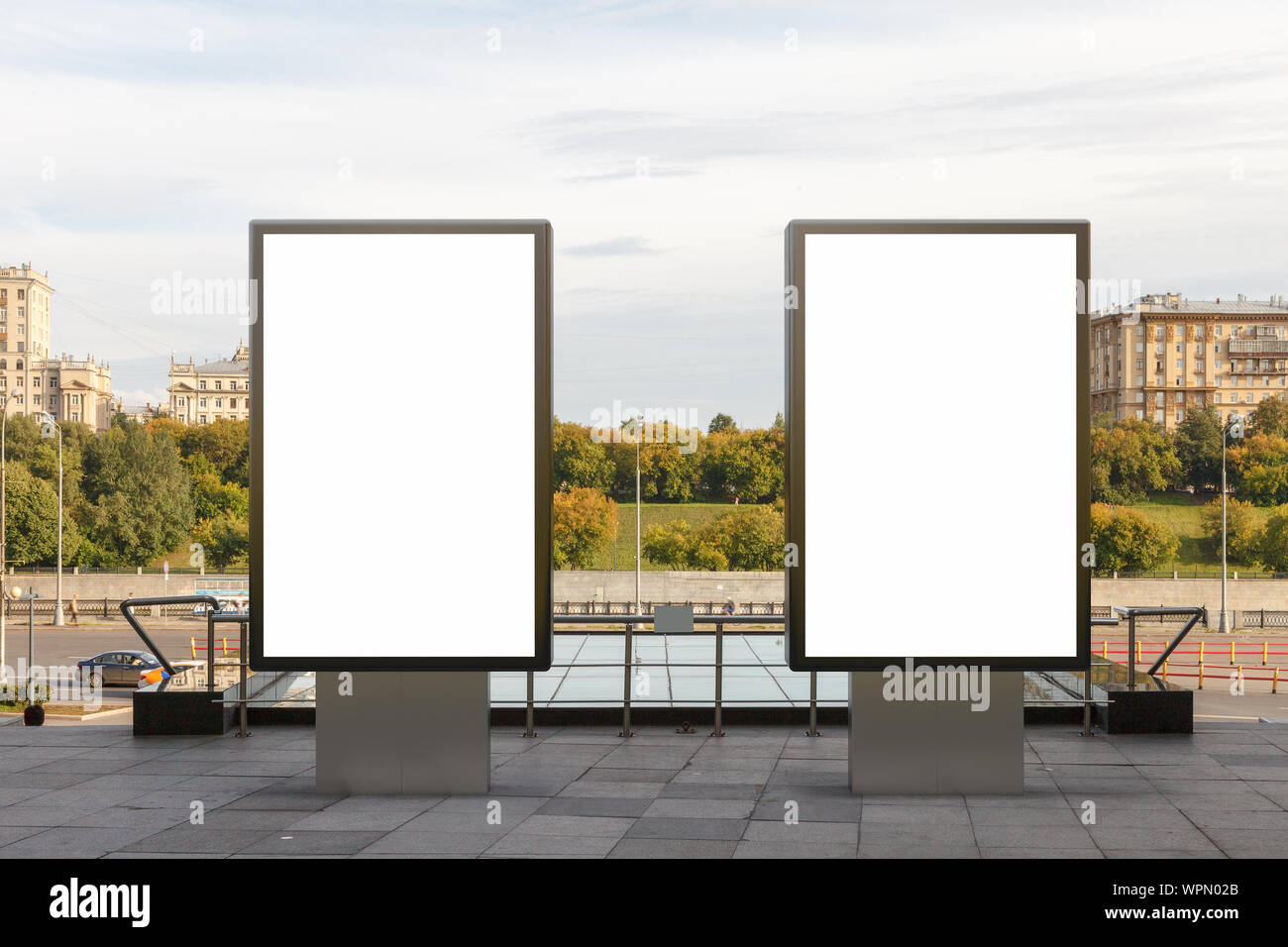 Two blank street billboard poster stands mock up in downtown with city ...