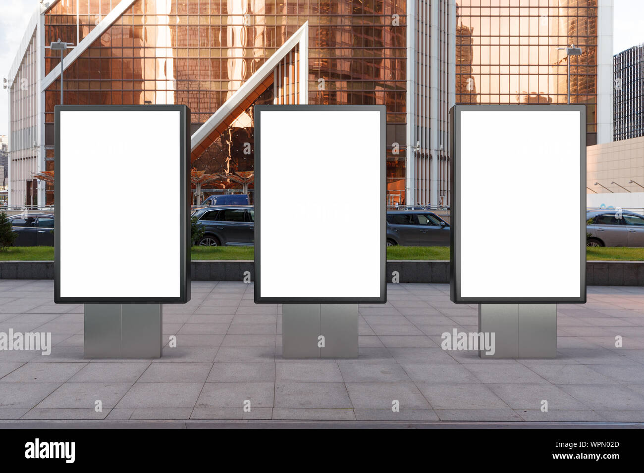 Three blank street billboard poster stands mock up in city downtown ...