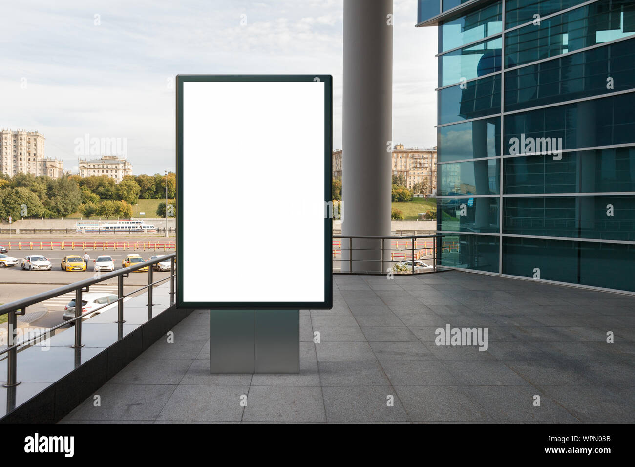 Blank street billboard poster stand mock up in downtown with city ...