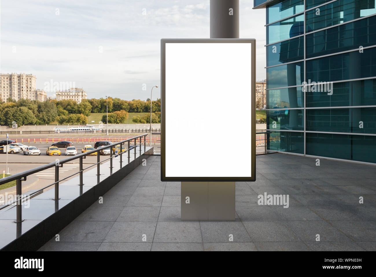 Blank street billboard poster stand mock up in downtown with city ...