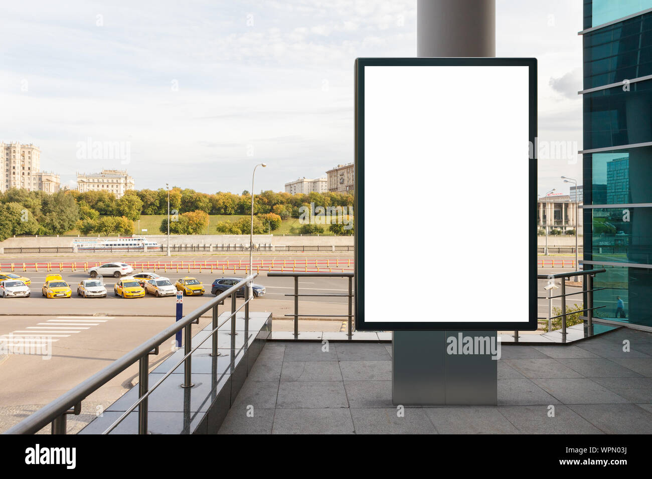 Blank street billboard poster stand mock up in downtown with city ...