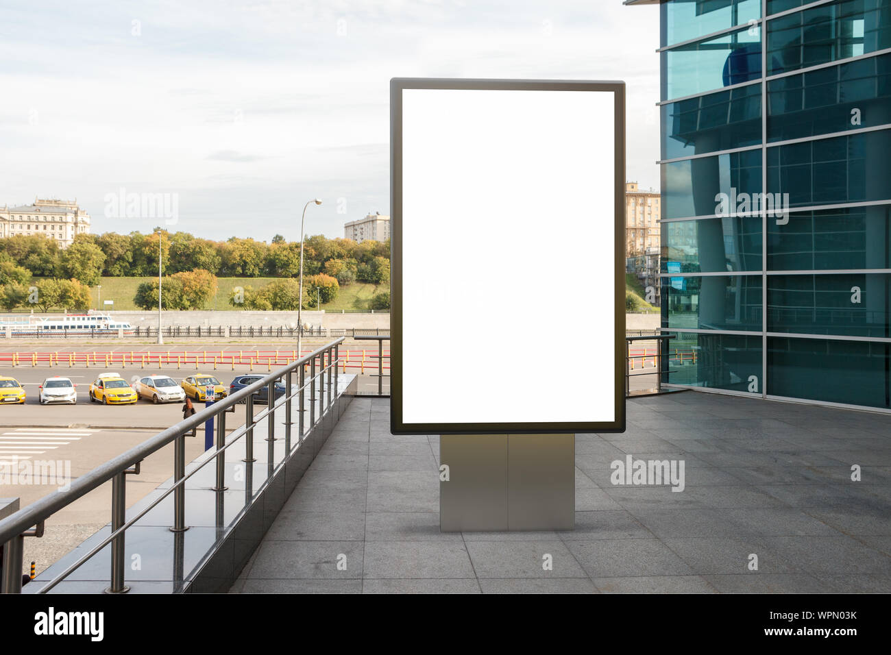 Blank street billboard poster stand mock up in downtown with city ...