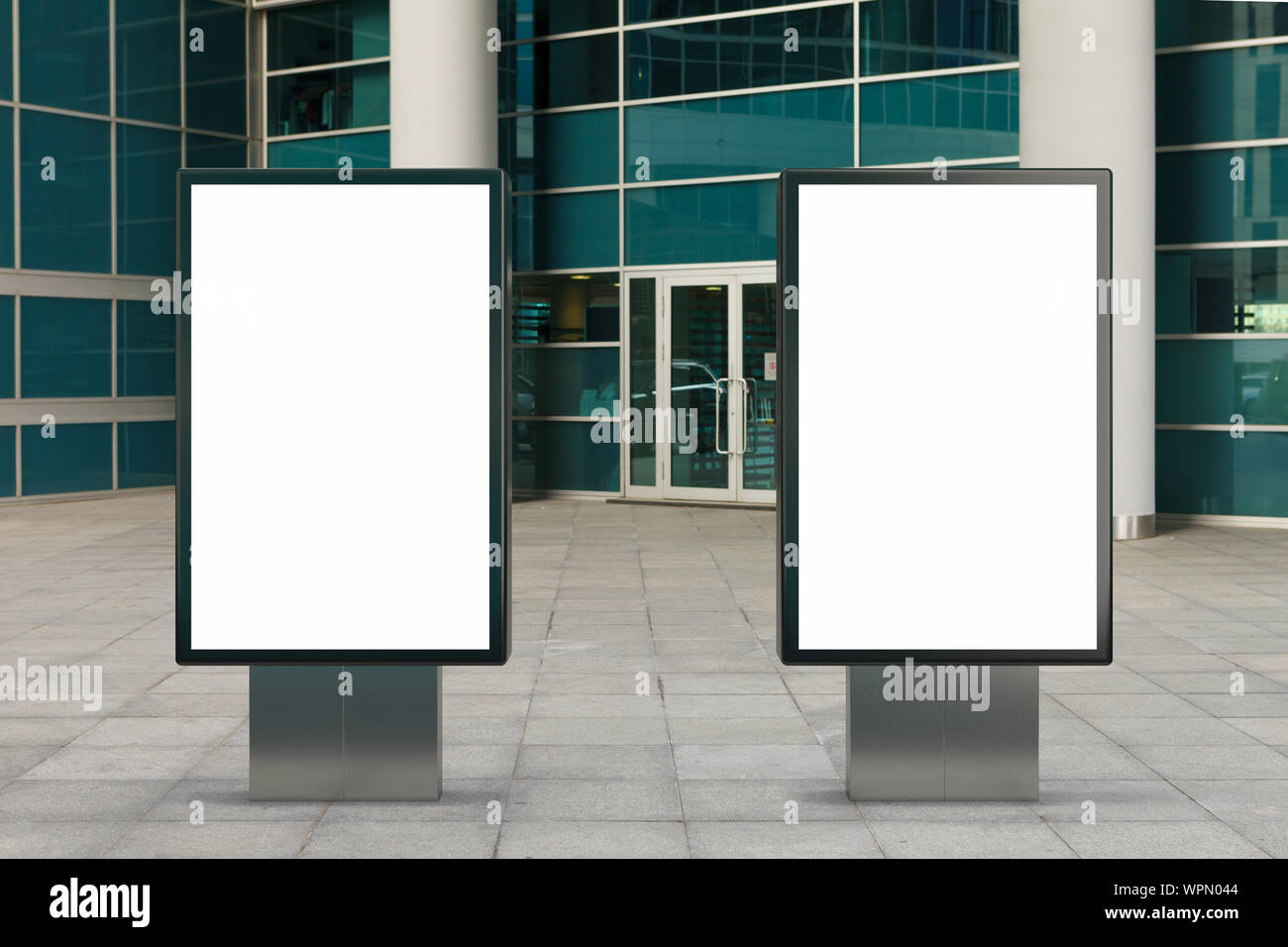 Two blank street billboard poster stands mock up in downtown with ...