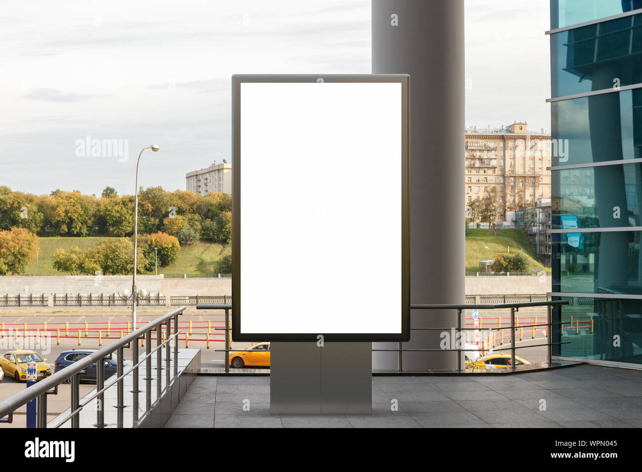 Blank street billboard poster stand mock up in downtown with city ...