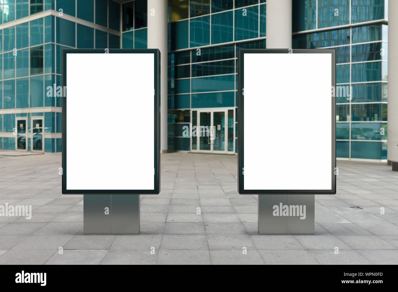 Two blank street billboard poster stands mock up in downtown with ...