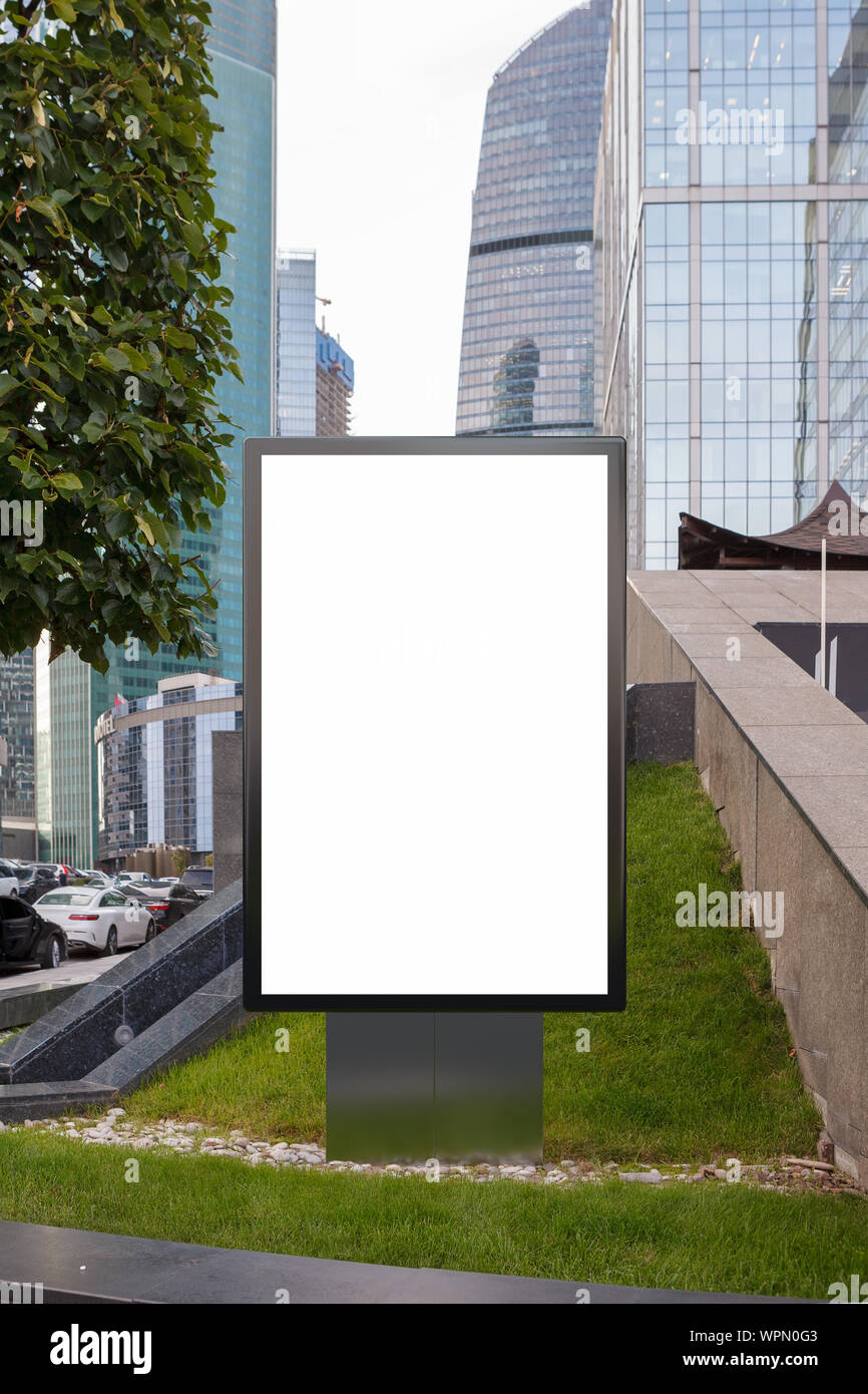 Blank street billboard poster stand mock up on the lawn in downtown ...