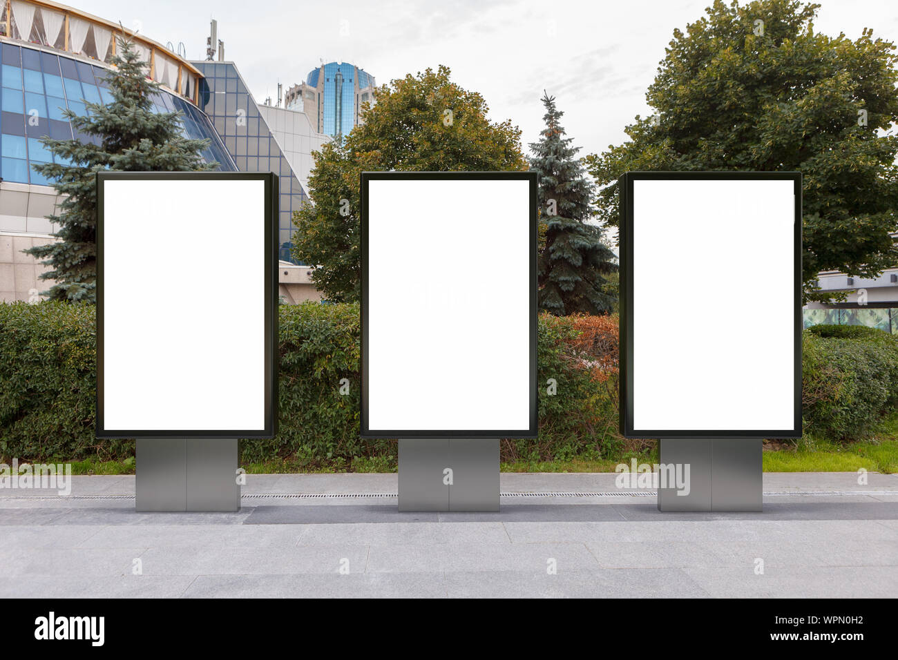 Three blank street billboard poster stands mock up in downtown Stock ...