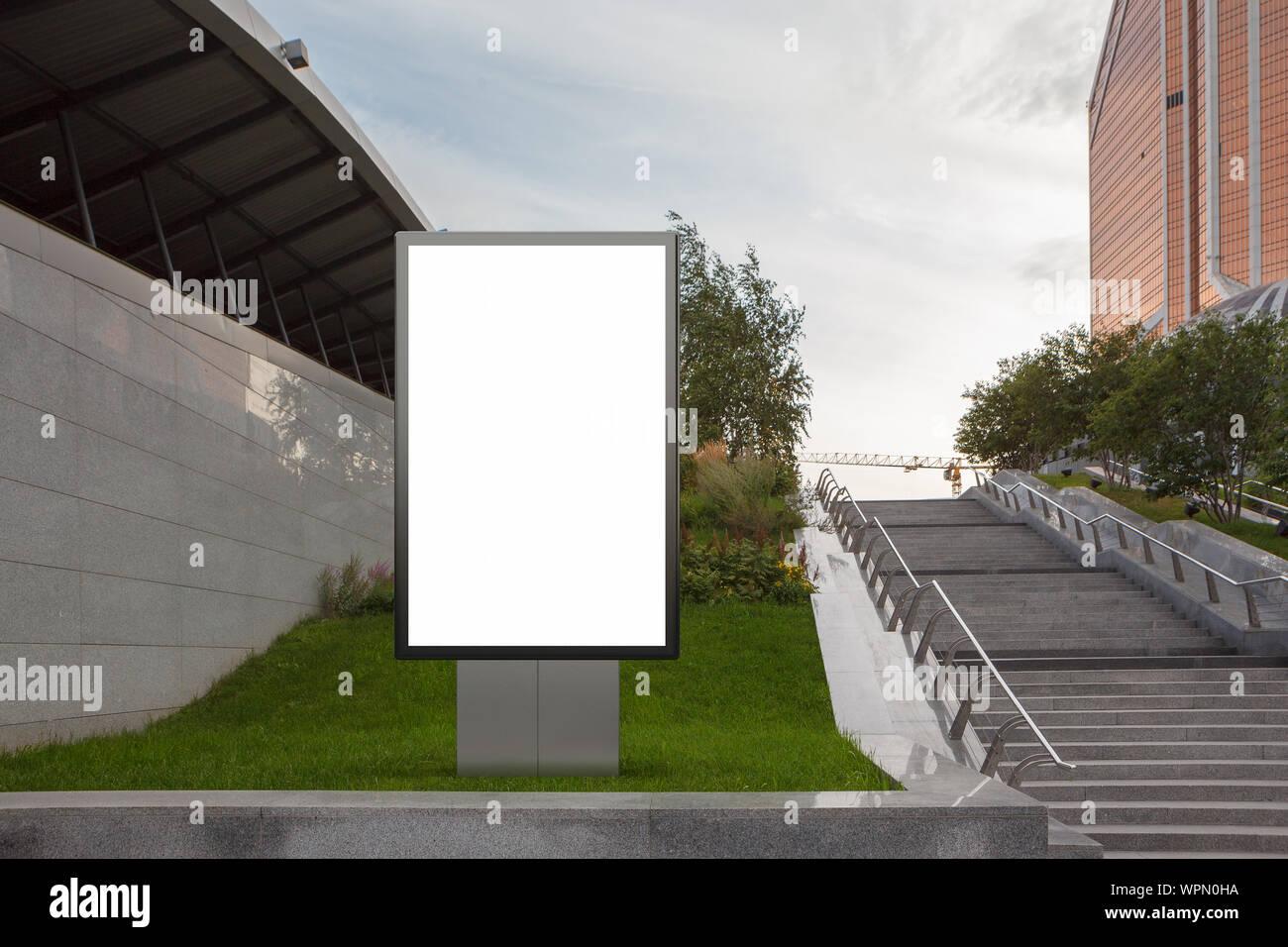 Blank street billboard poster stand mock up in on the lawn in the ...