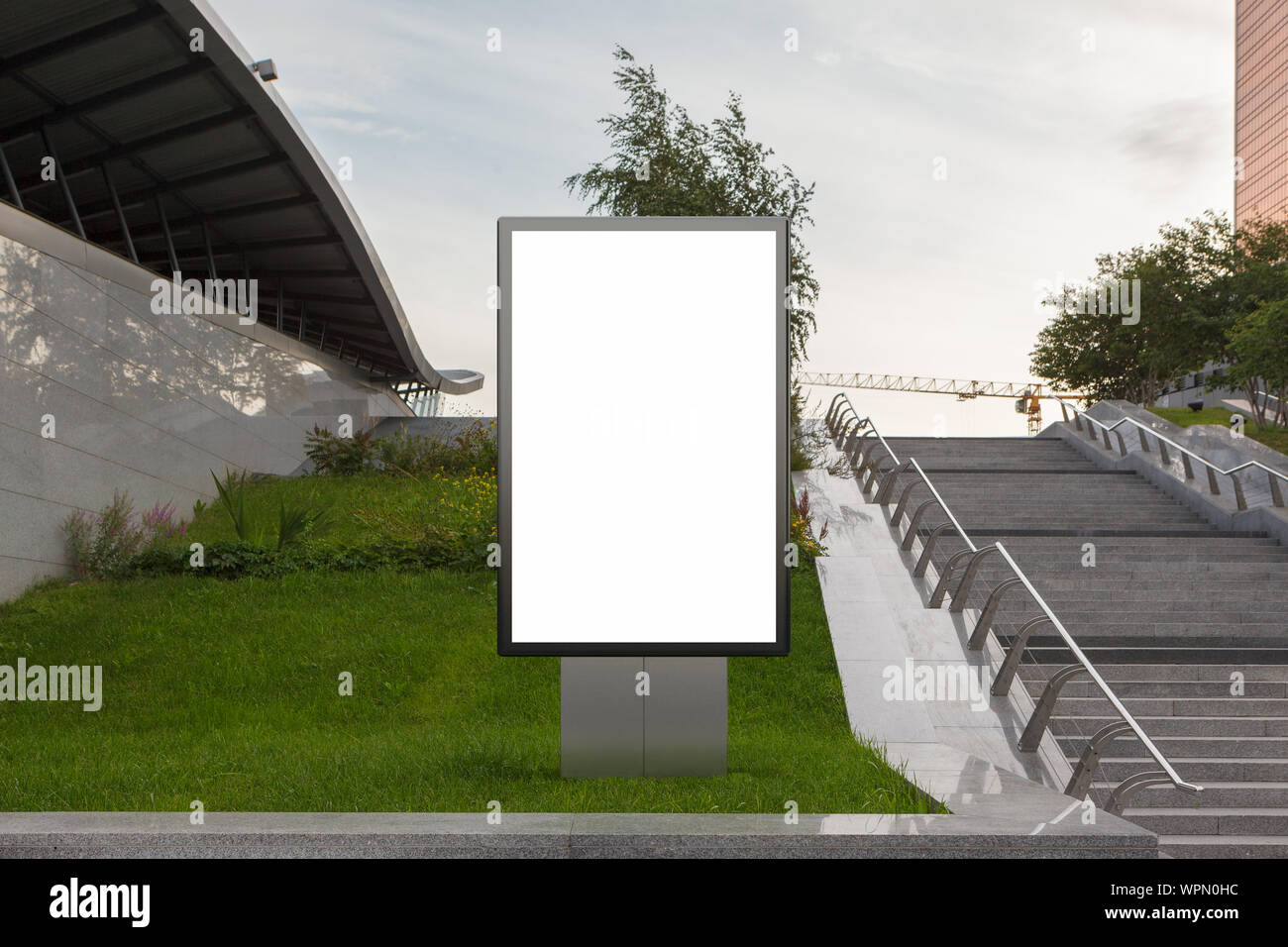 Blank street billboard poster stand mock up in on the lawn in the ...