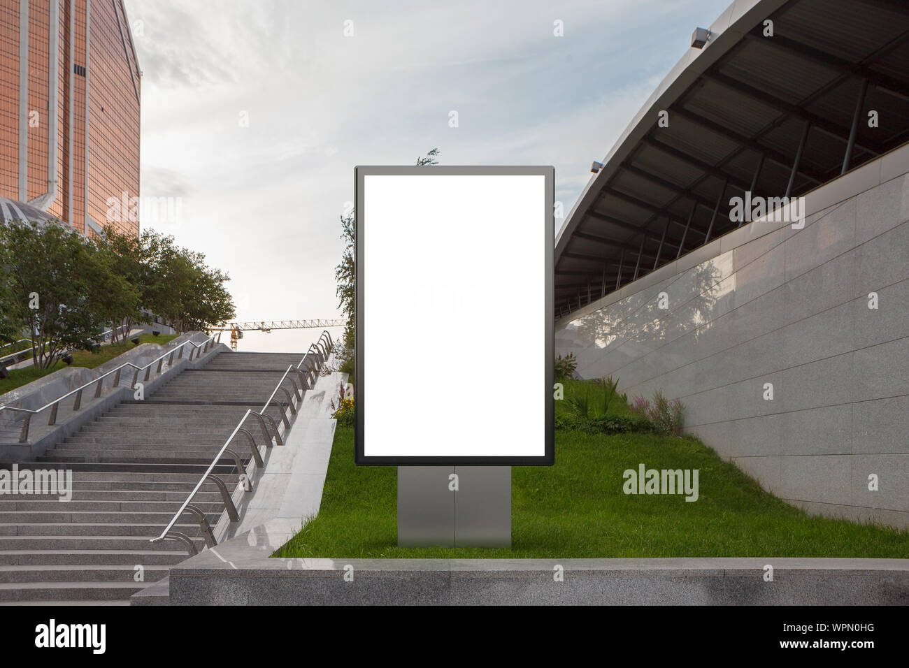 Blank street billboard poster stand mock up in on the lawn in the ...