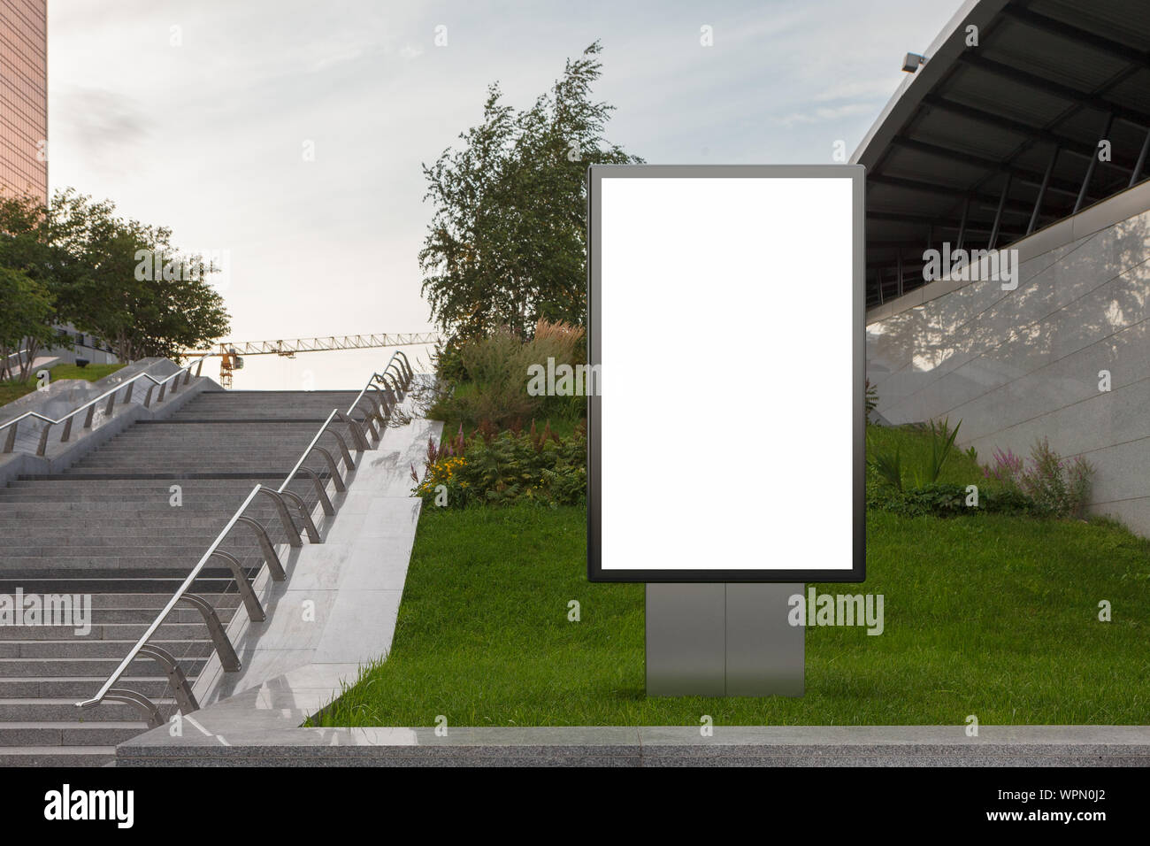 Blank street billboard poster stand mock up in on the lawn in the ...