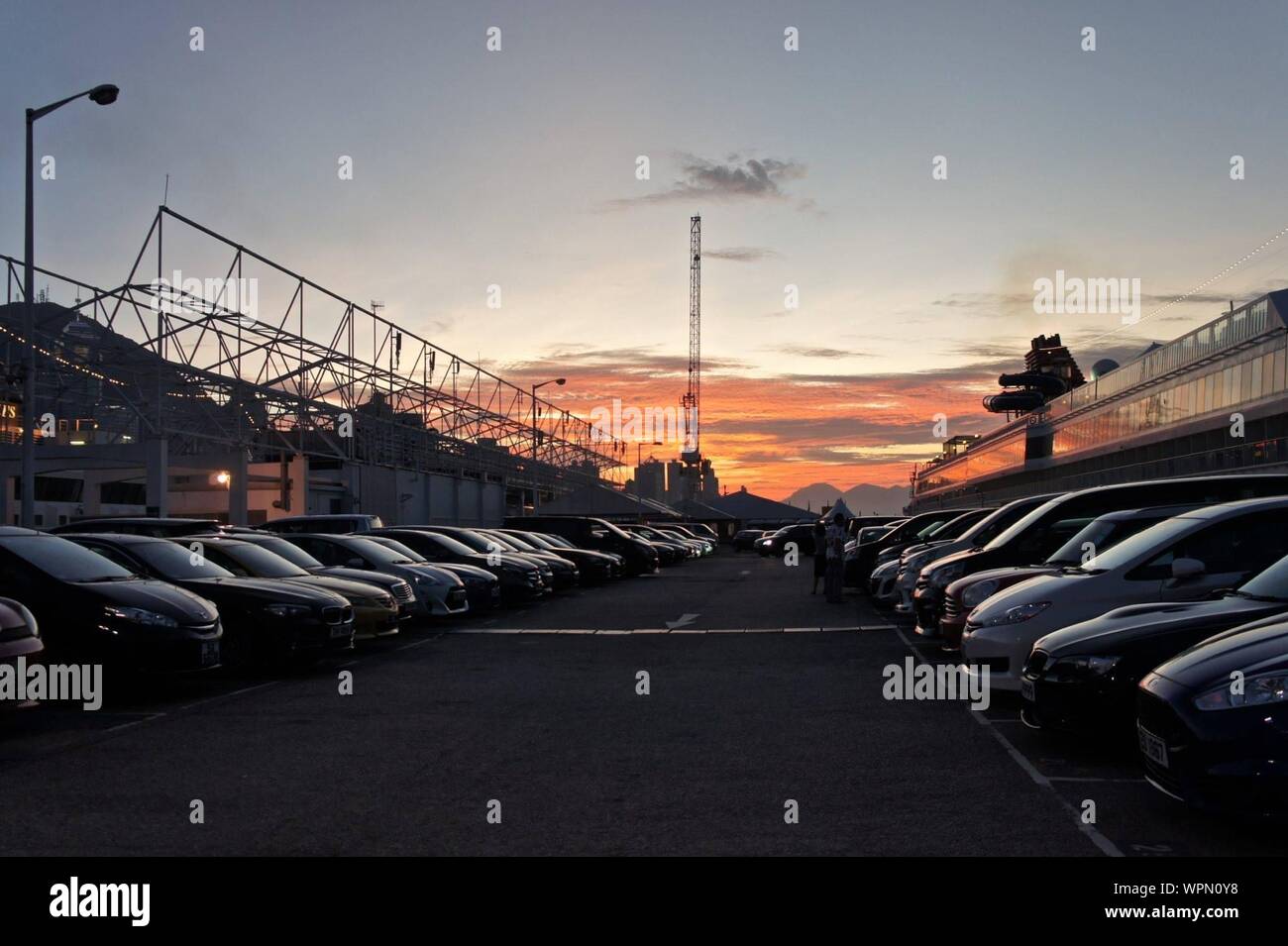 Cars parking lot against sky hi-res stock photography and images - Alamy