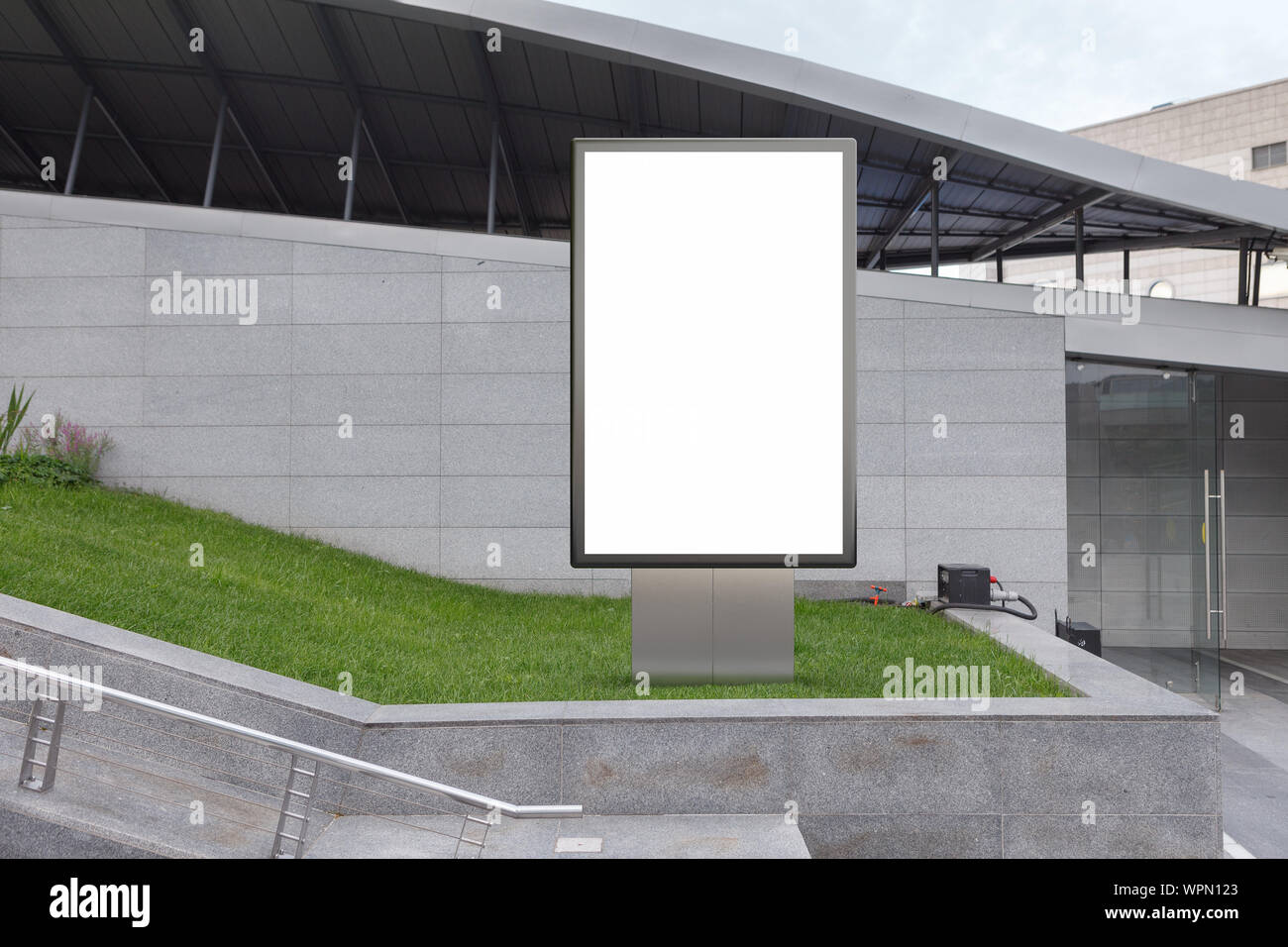 Blank street billboard poster stand mock up in on the lawn in the ...