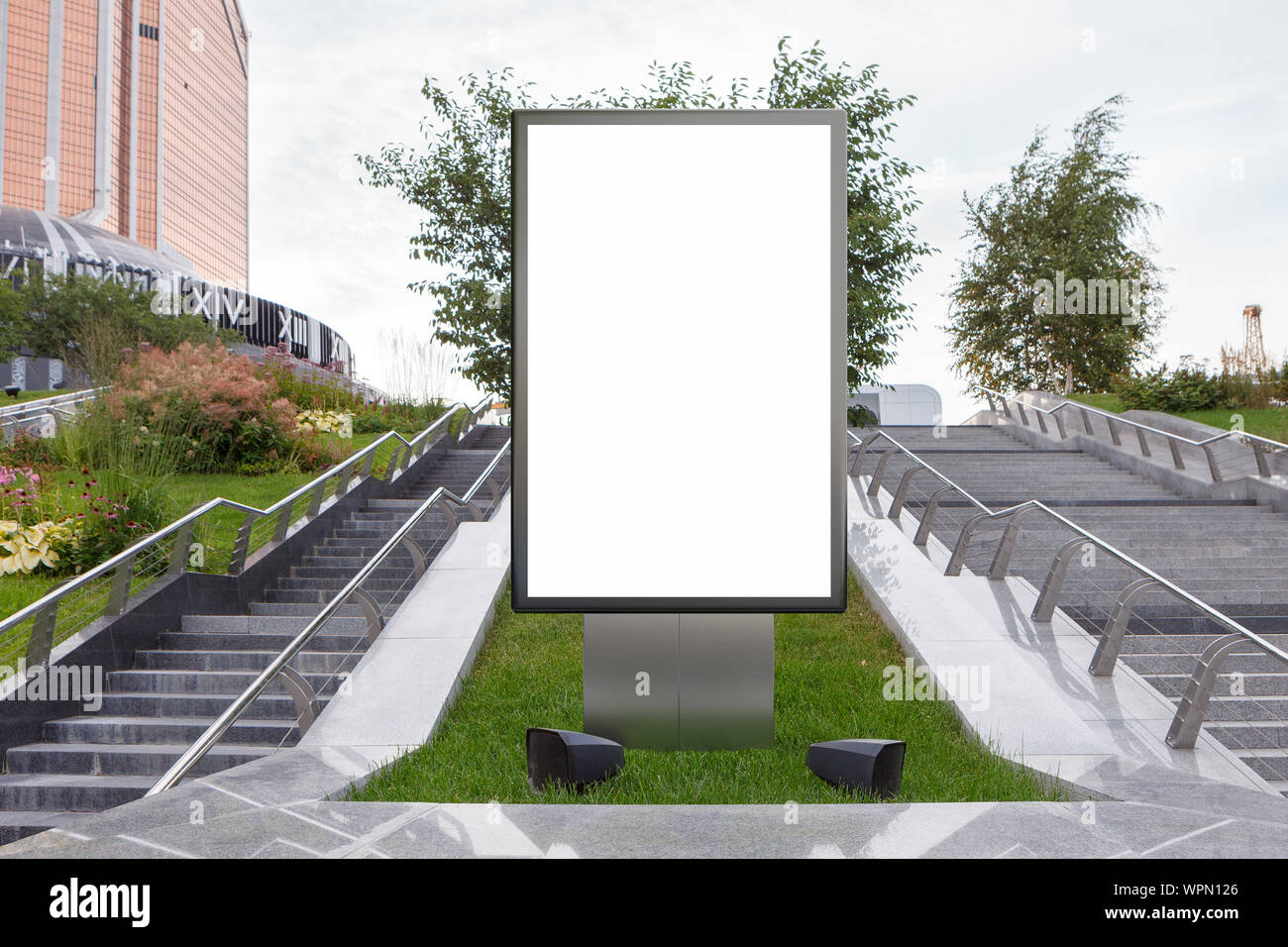 Blank street billboard poster stand mock up in on the lawn in the ...