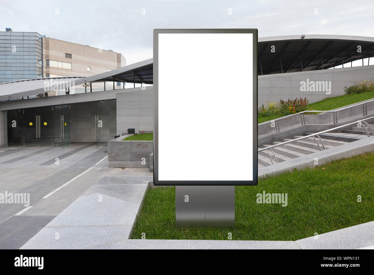 Blank street billboard poster stand mock up in on the lawn in the ...