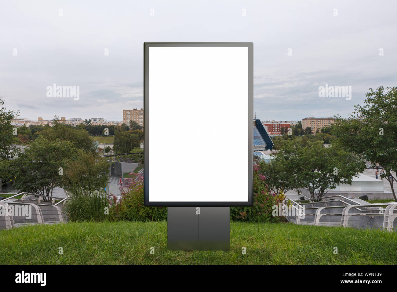Blank street billboard poster stand mock up in on the lawn in the ...