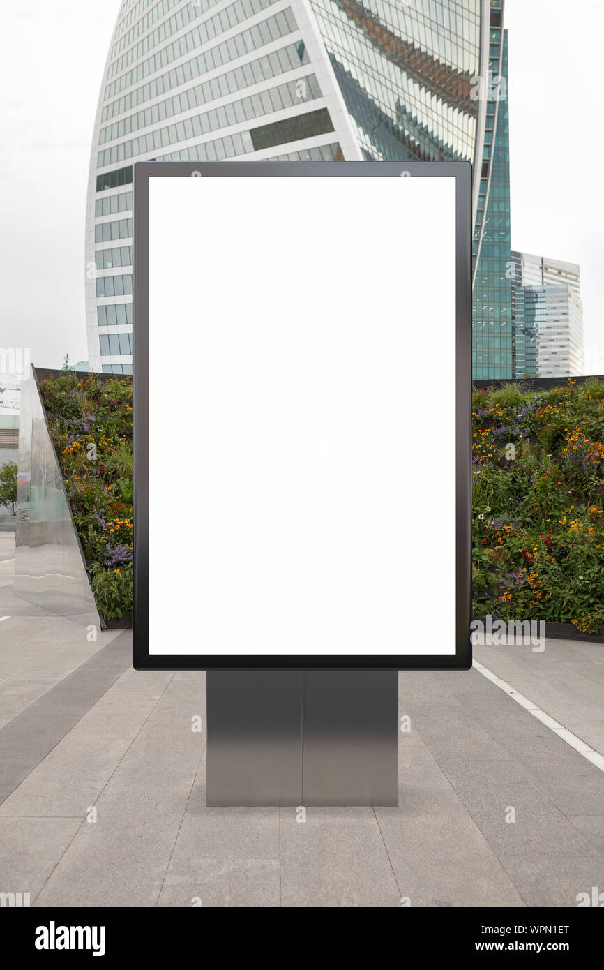 Blank street billboard poster stand mock up in downtown wth skyscraper ...