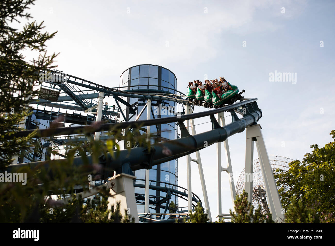 Riders speed around a curve on the EuroMir roller coaster at EuropaPark in Rust, Germany Stock