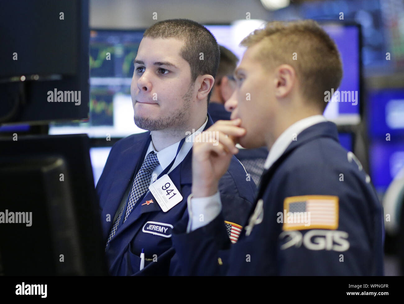 Traders Work On The The Floor Of The New York Stock Exchange