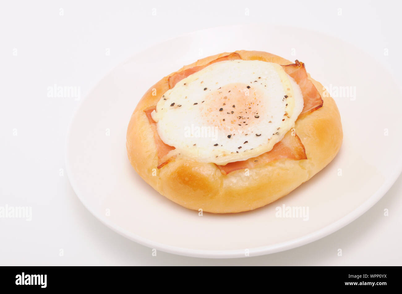 bacon egg bread on plate isolated on white background Stock Photo