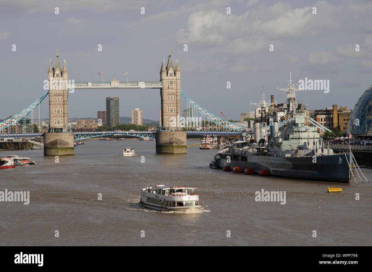 HMS Belfast in the Thames with tower bridge as a background Stock Photo