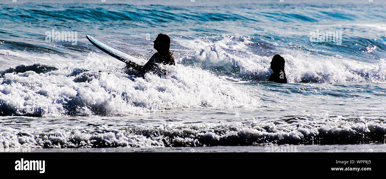 Women surfing hi-res stock photography and images - Alamy