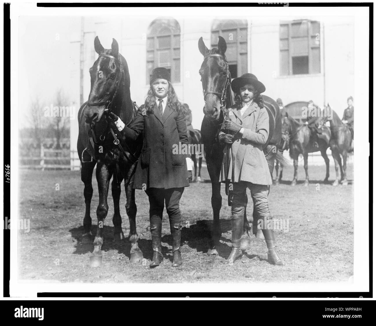 Lucy Leffingwell, daughter of Russell C. Leffingwell, and Carolyn Chamberlain, daughter of General J.C. Chamberlain, posed with their horses, probably in New York City area Stock Photo
