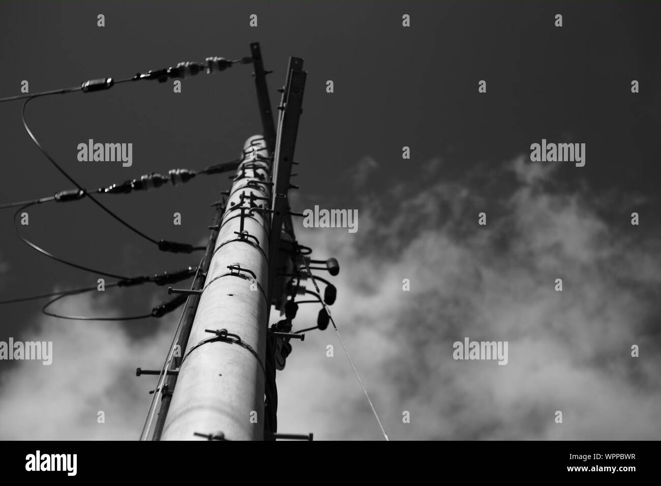 Low Angle View Of Eclectic Pole Against Sky Stock Photo