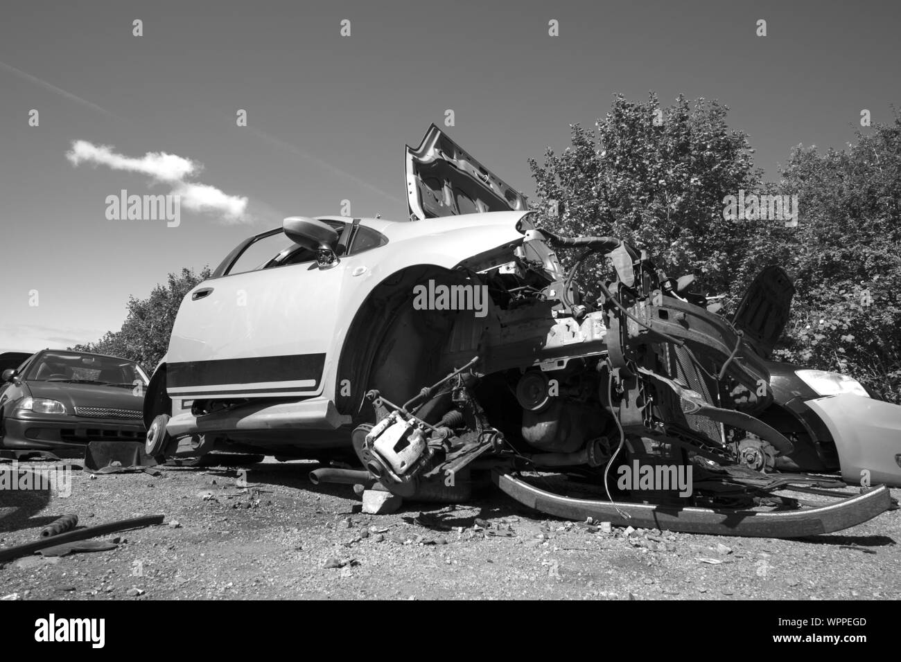 Smashed and wrecked car in a scrap yard Stock Photo - Alamy